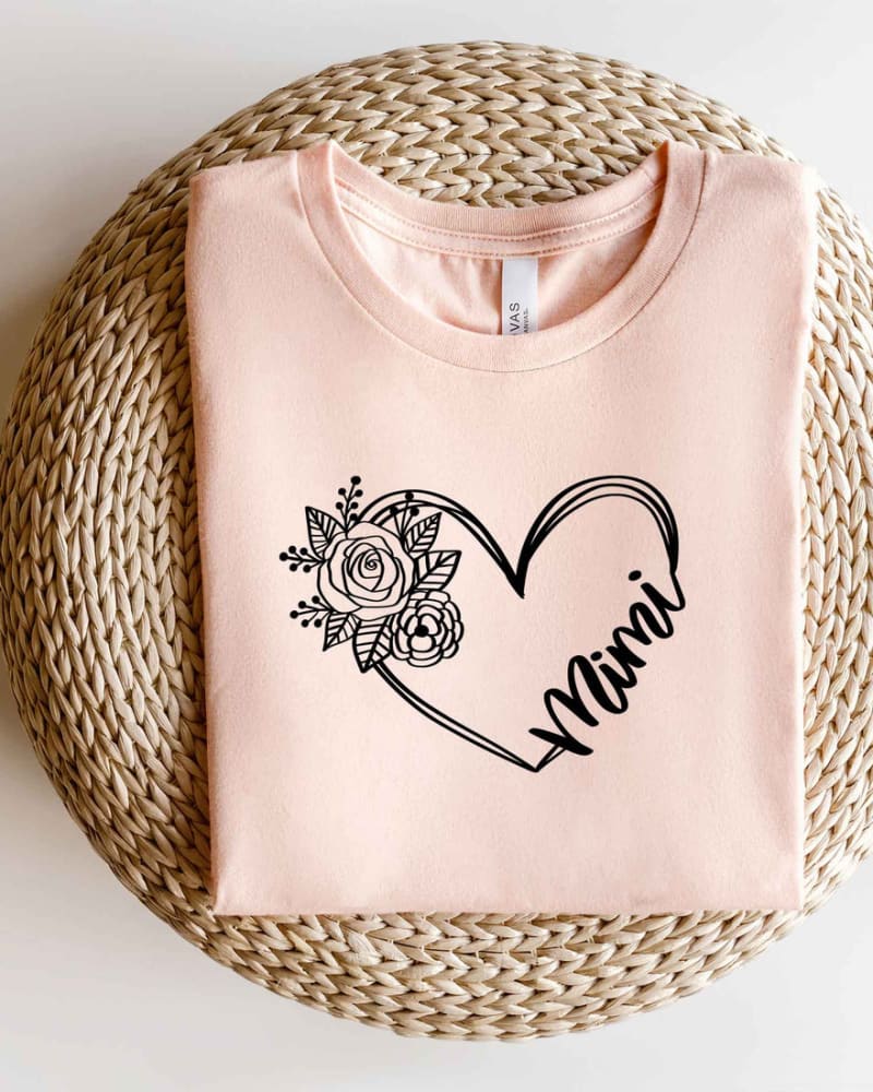 Front of a model wearing a size L Mimi Heart Outline Short Sleeve Graphic Tee in Blush by Simply Sage Market. | dia_product_style_image_id:290769